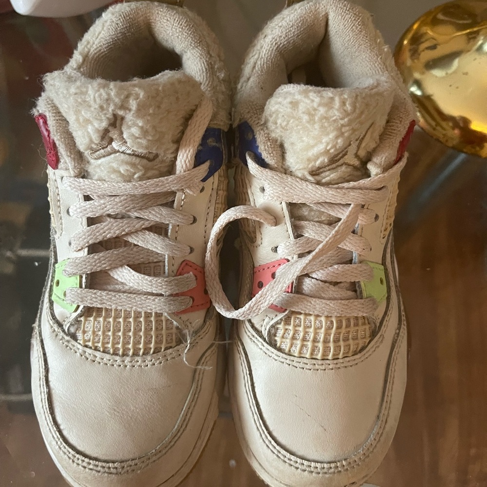 Beige Jordan’s size 12 c with green , pink and royal blue accents for girls